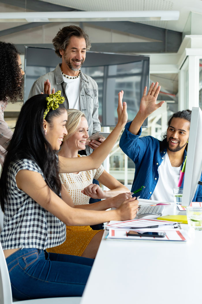 happy-diverse-business-people-giving-high-five-2